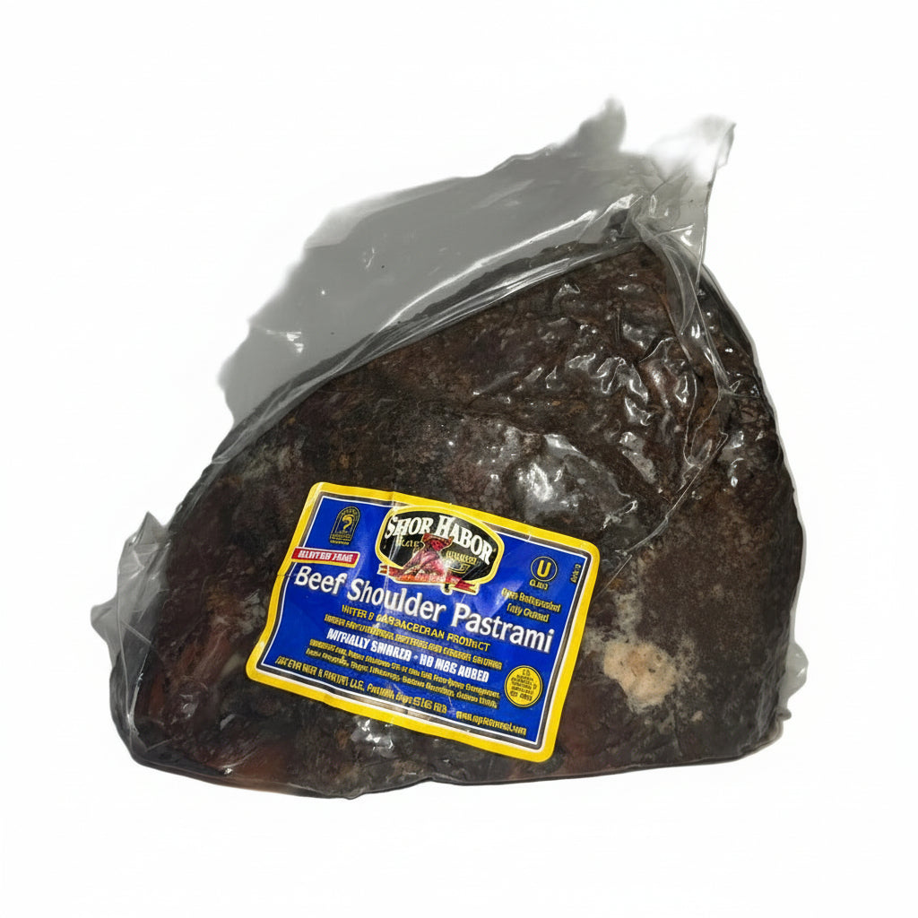 Packaged beef shoulder pastrami with a label on a white surface