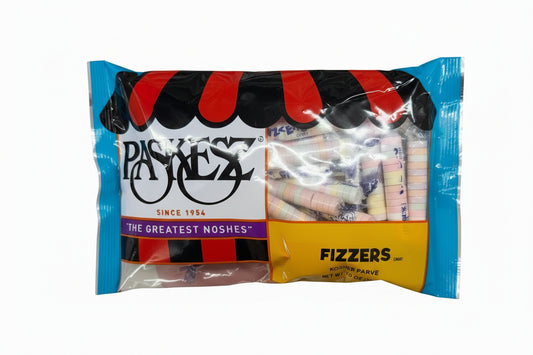 Hand holding a package of Paskez Fizzers 