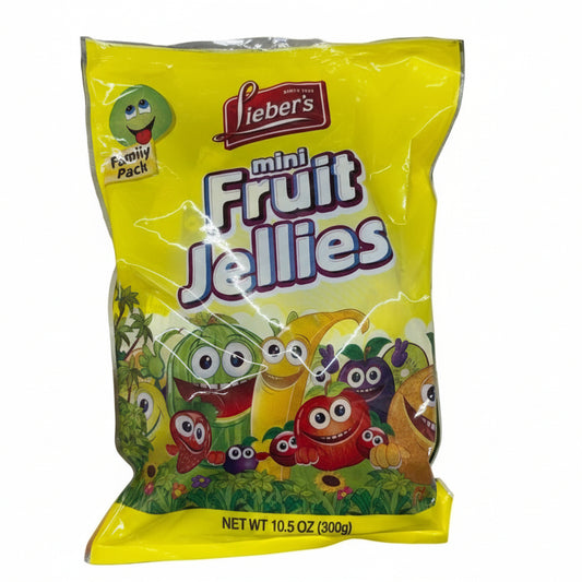 Hand holding a package of Lieber's mini fruit jellies with colorful cartoon characters
