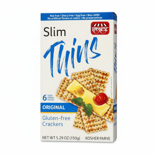 Box of Parchez Slim Thins crackers with cheese and tomato on a white background