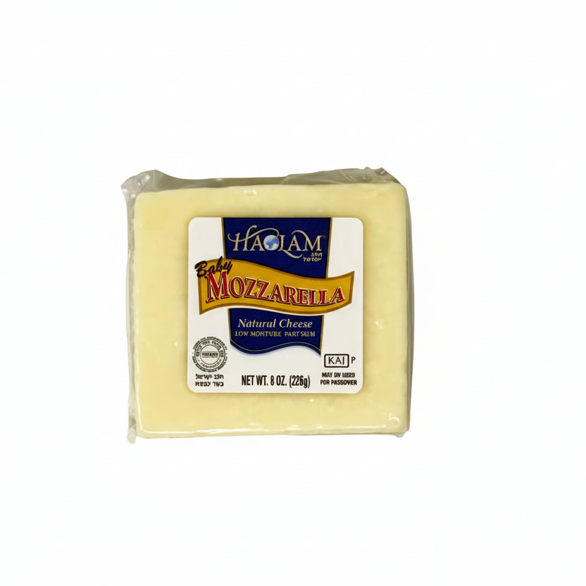 Block of mozzarella cheese with a label on a white background