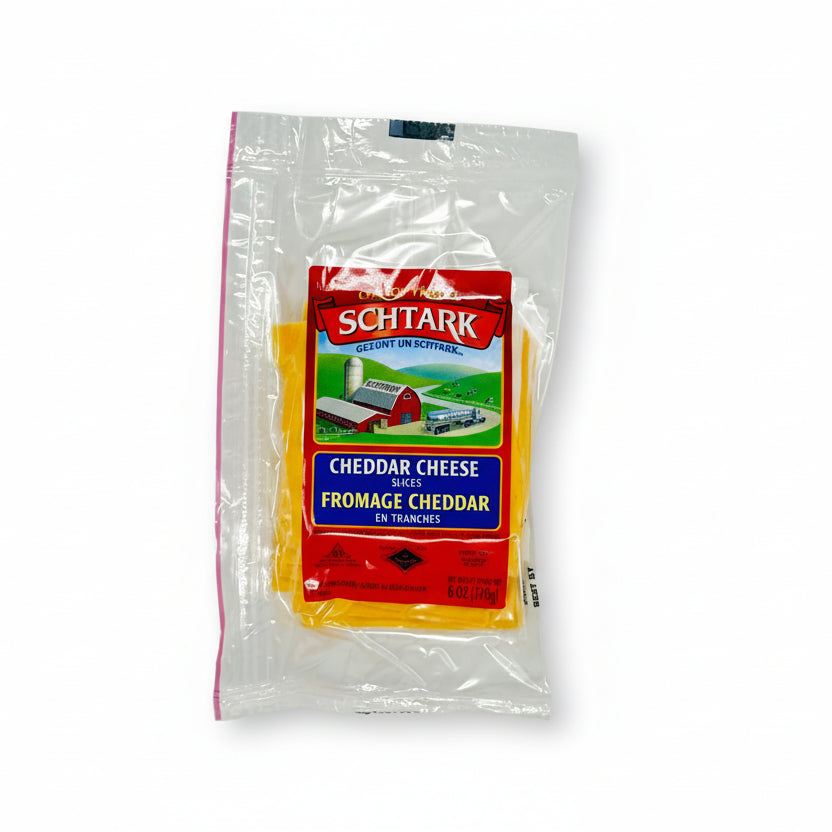 Package of Schtark Cheddar Cheese slices on a white background