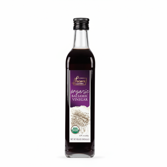 Bottle of organic balsamic vinegar on a white background
