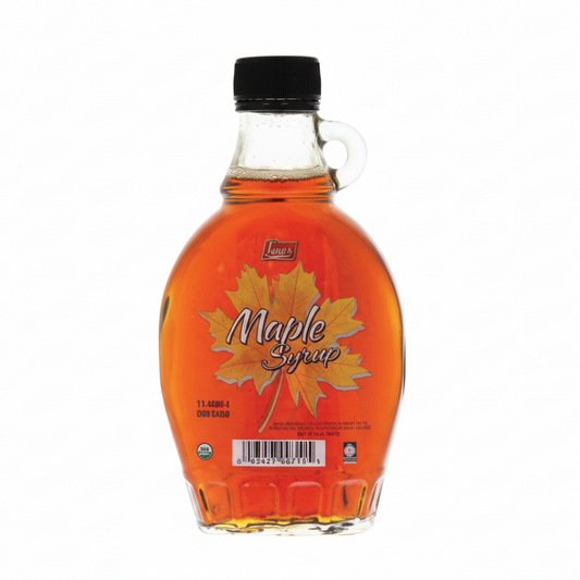 Bottle of maple syrup with a black cap on a white background