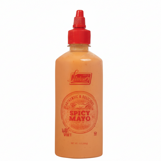 Bottle of spicy mayo with a red cap on a white background